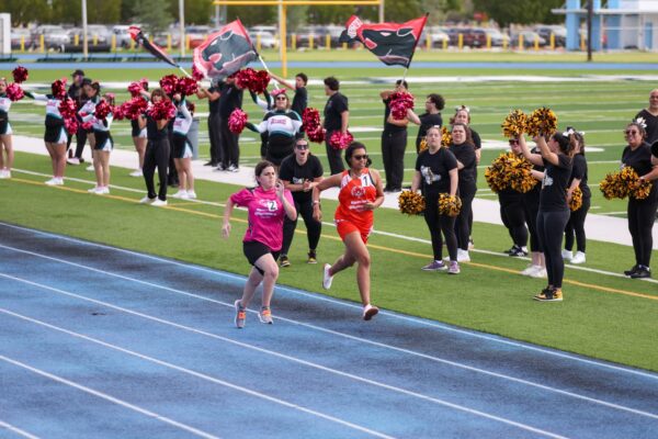 group cheerleaders running track
